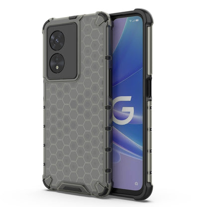 Shockproof phone case with honeycomb pattern, dark gray/charcoal with raised rim.