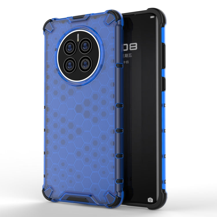 Shockproof phone case with honeycomb pattern, blue; four-camera back cutout.