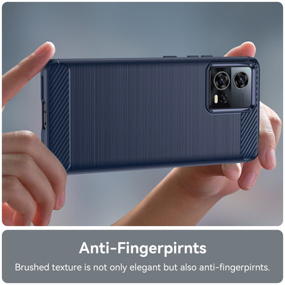 Blue brushed TPU phone case with carbon fiber camera area held in hands