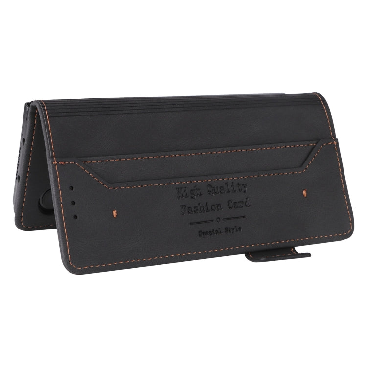 Black leather flip phone case with card holder panel and stitching detail