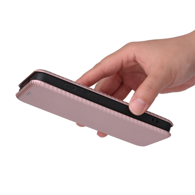 Pink flip phone case held in a hand, side view showing the flip edge.