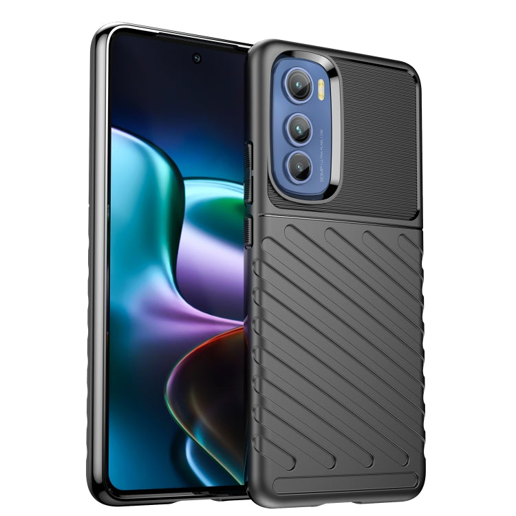 Dark blue rugged TPU phone case with textured grip, side openings, and camera module cutout