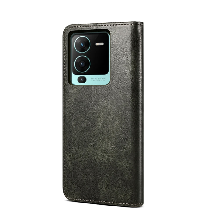 Dark green crazy horse leather flip phone case with camera cutout and stitched edges