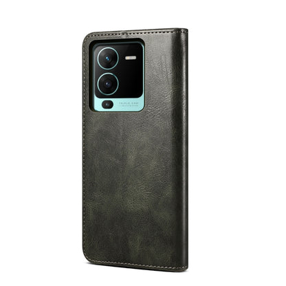 Dark green crazy horse leather flip phone case with camera cutout and stitched edges