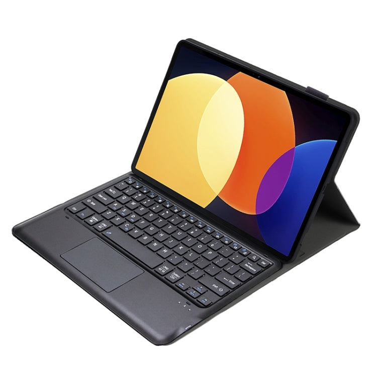 Dark gray tablet case with Bluetooth keyboard and touchpad, open and angled
