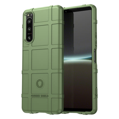 Green rugged TPU phone case with raised edges and textured grip