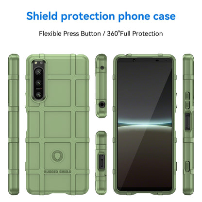 Green rugged TPU phone case, front and back view with port cutouts