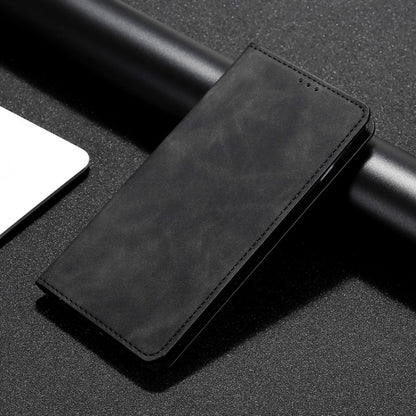 Magnetic flip leather phone case in black, close-up of stitched edge and smooth texture