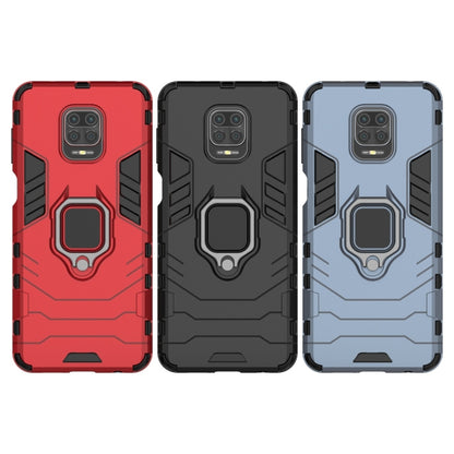 Shockproof phone cases in red, black, and light blue, each with magnetic ring holder