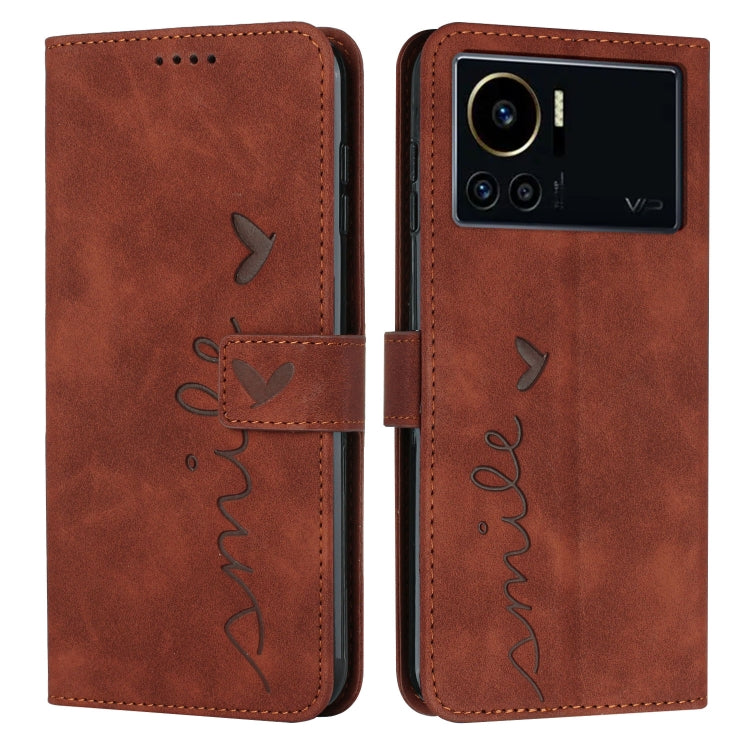 Brown leather phone case with heart pattern, flip cover and cutouts for camera and buttons