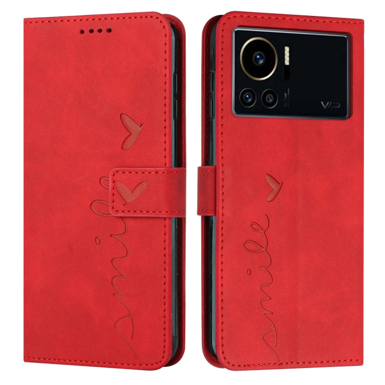 Red leather phone case with heart pattern and phone camera opening on back side