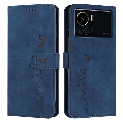 Blue leather phone case with heart pattern and visible camera cutout on back side
