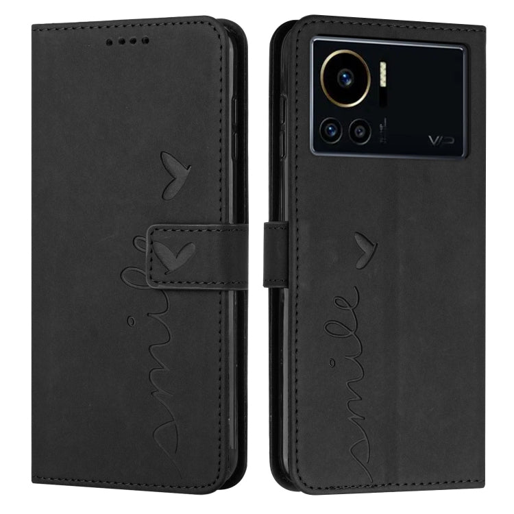 Black leather phone case with heart pattern and visible camera cutout on back side