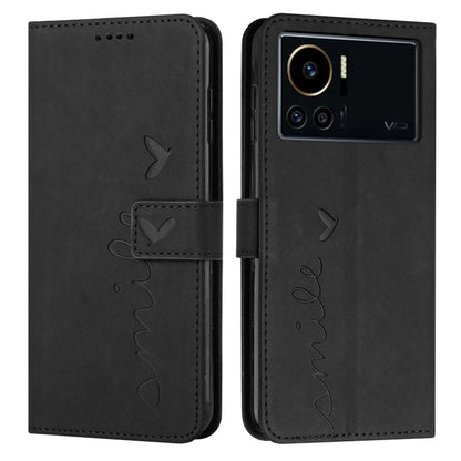 Black leather phone case with heart pattern and visible camera cutout on back side