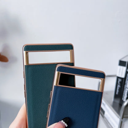 Pair of teal and navy textured leather phone cases with rectangular card-slot windows
