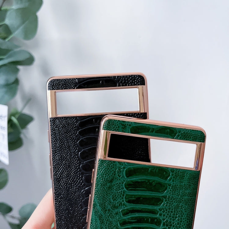 Genuine leather phone case in black and green, rose-gold frame, textured finish