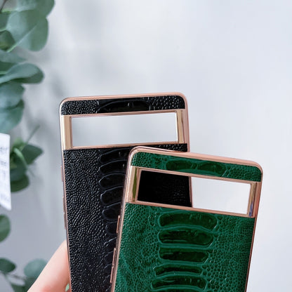 Genuine leather phone case in black and green, rose-gold frame, textured finish