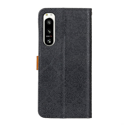 Embossed floral leather phone case, black with camera cutout and textured back