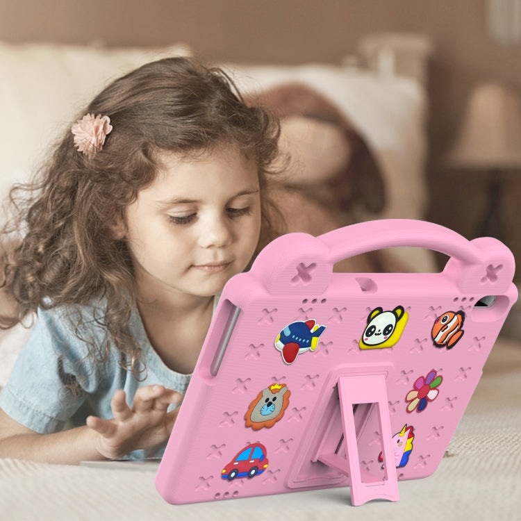 Pink kids tablet case with handle and kickstand, shown being used by a child