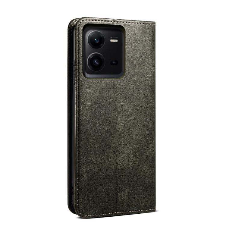 Dark green leather phone case with camera cutout and reinforced edges