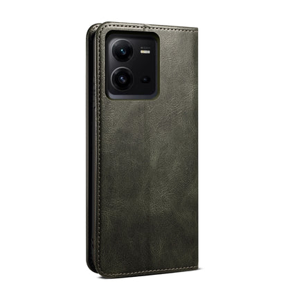 Dark green leather phone case with camera cutout and reinforced edges