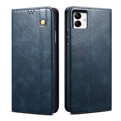 Blue leather flip phone case with front tab and camera cutout on back