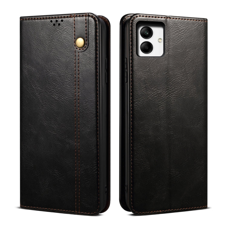 Black leather phone case with textured grain, contrast stitching, and dual camera cutout