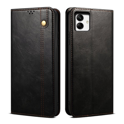 Black leather phone case with textured grain, contrast stitching, and dual camera cutout