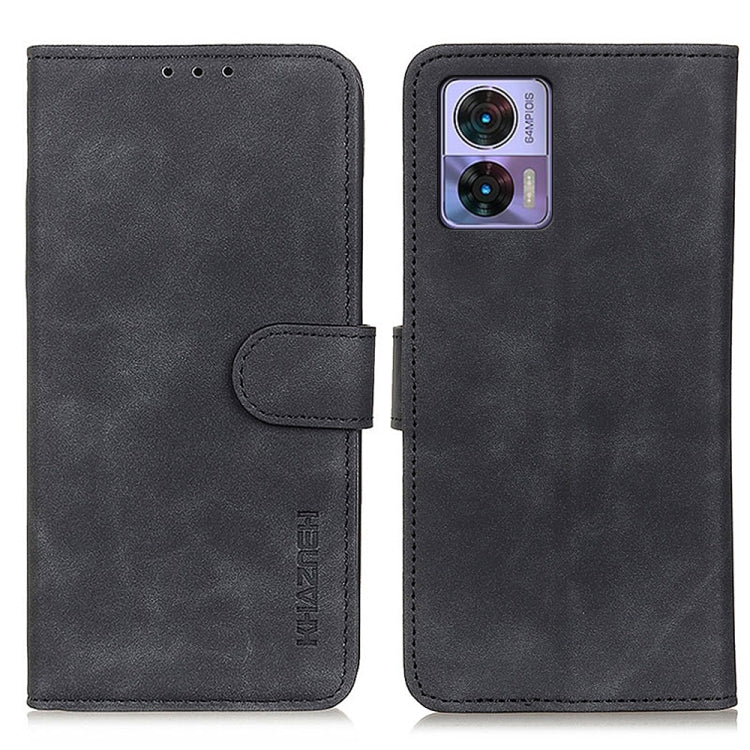 Black leather folio phone case with flip cover, strap tab, and camera cutout