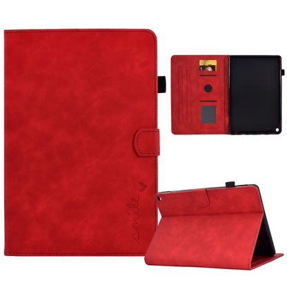 Embossed smile tablet leather case in red with folio stand and magnetic flap