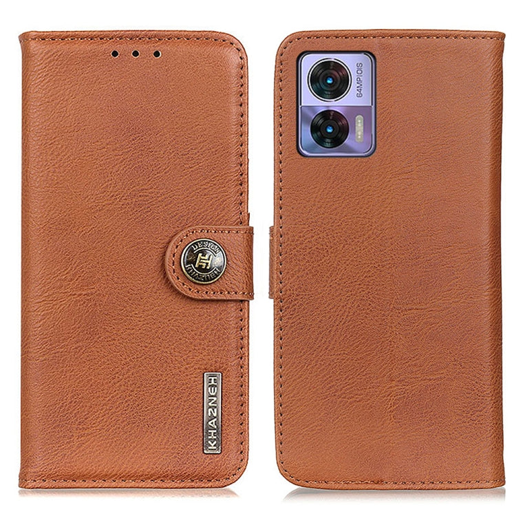Brown leather phone case with magnetic flap, cowhide texture, and camera cutout