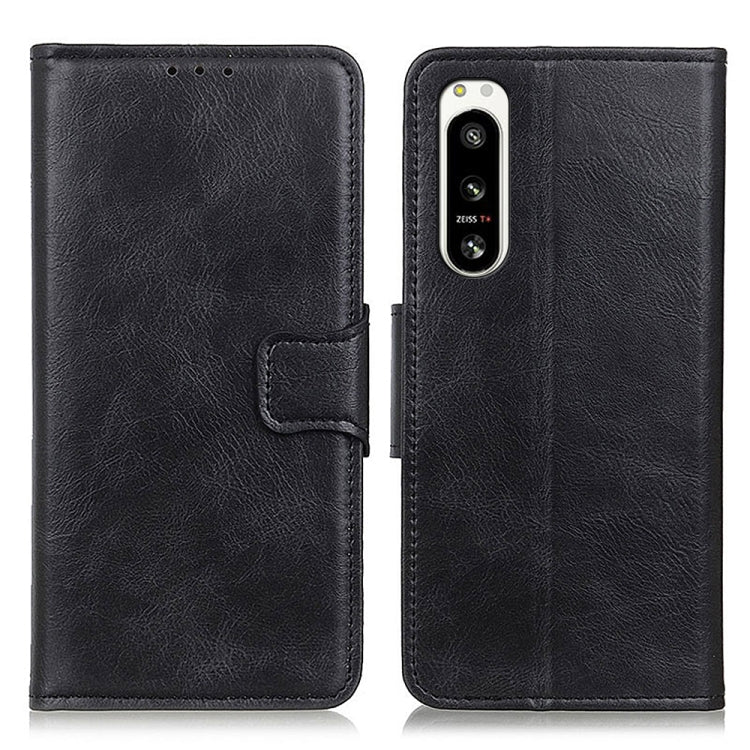 Black textured leather flip phone case set with camera opening and side strap.