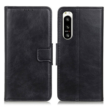 Black textured leather flip phone case set with camera opening and side strap.