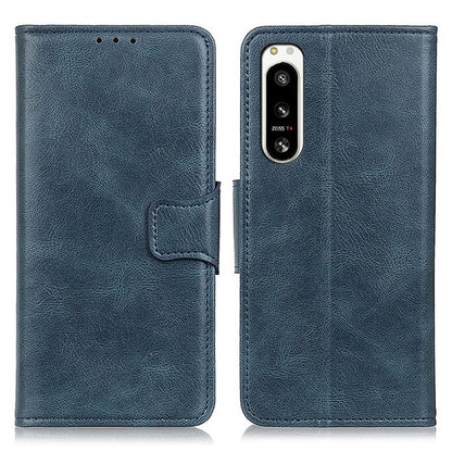 Blue textured leather flip phone case with front flap and camera opening.
