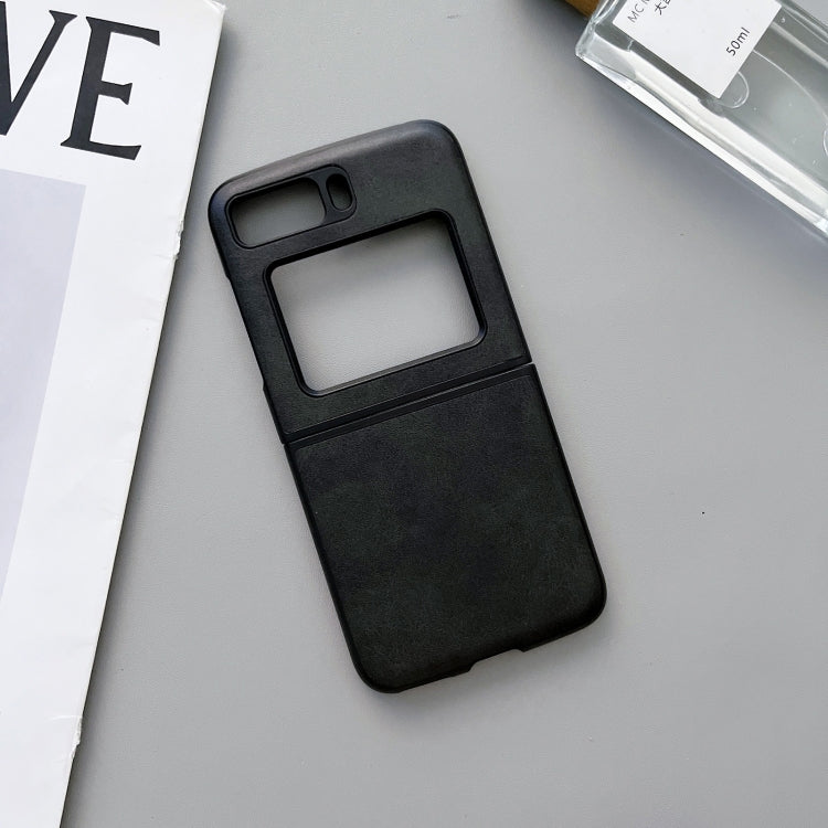 Two-tone leather phone case, black cowhide texture, angled view with camera cutout.