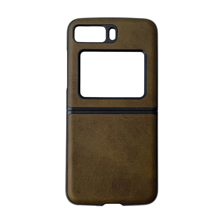 Two-tone leather phone case, dark green cowhide texture with black trim and window cutouts.