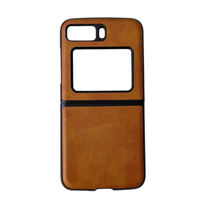 Two-tone leather phone case, brown cowhide texture with black trim and camera cutout.