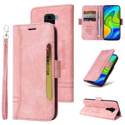 Pink leather phone case with card holder pocket, wrist strap, and flip cover