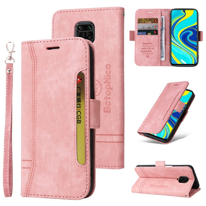 Pink leather flip phone case with wrist strap, buckle, card slots, camera cutout.