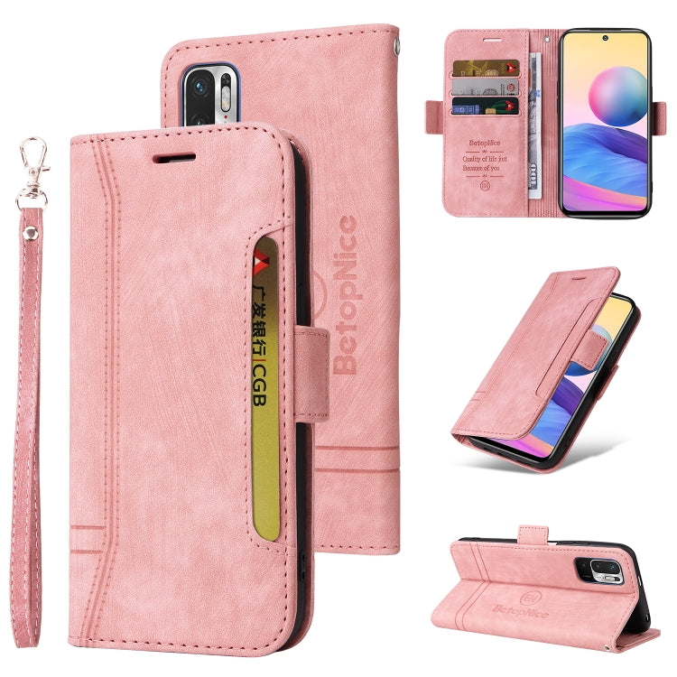 Pink leather wallet-style phone case with wrist strap, buckle, card slots, stand fold.
