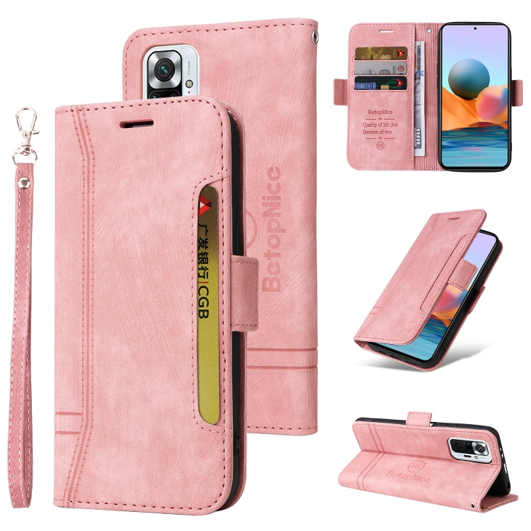 Pink leather flip phone case with wrist strap, buckle closure, card slots, camera opening.