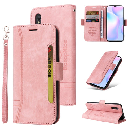 Pink leather flip phone case with wrist strap, card slots, dual-side buckle, camera cutout.