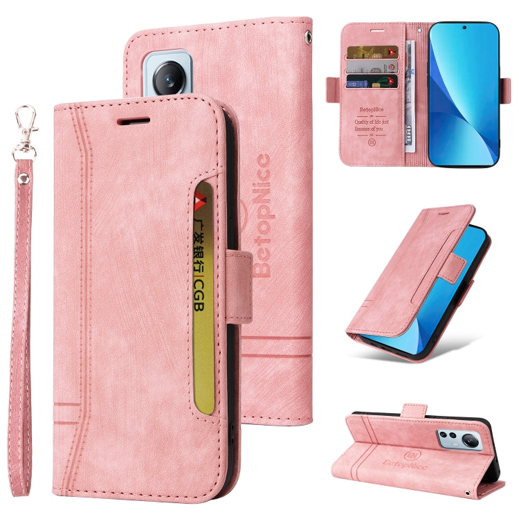 Pink leather phone case with wrist strap, buckle closure, card slots, fold-out stand.