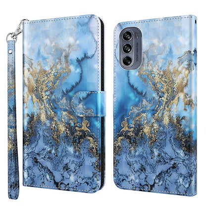 Blue phone case with gold marbled swirl pattern and cloudy texture, wrist strap