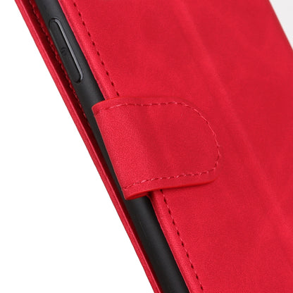 Red leather flip phone case close-up with stitched side strap and protective cover