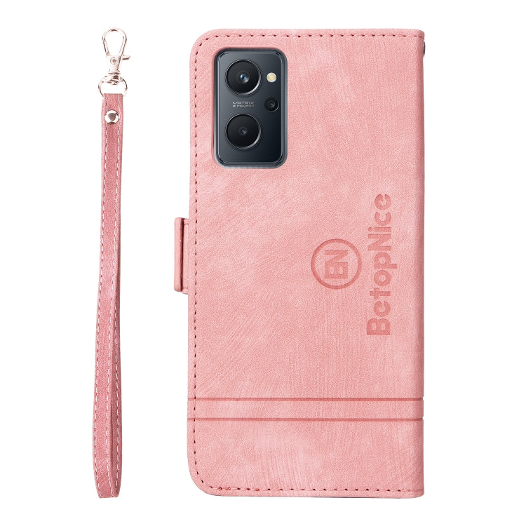 Pink leather phone wallet case with wrist strap, front camera cutout, and side button cover.