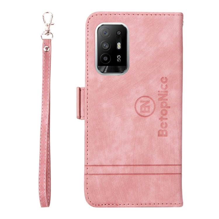 Pink leather phone case with camera cutout, card slot window, and wrist strap