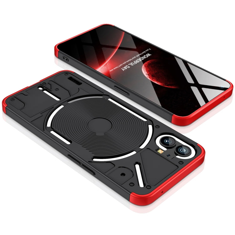 Black full-coverage phone case with red border; circular wireless charging pad