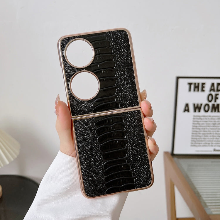 Black croc-texture phone case with two large metal rings and camera openings