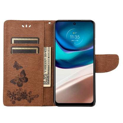 Brown flip leather phone case open view with card pocket slots and butterfly embossing.